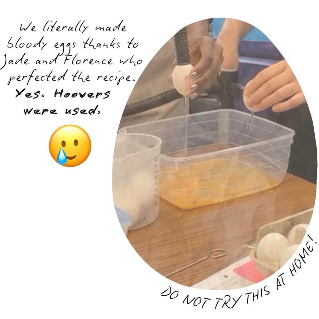 Hands holding eggs, a hoover hose on top and egg white running into a plastic tub. Text reads "We literally made bloody eggs thanks for Jade and Florence who perfected the recipe. Yes, Hoovers were used. Do not try this at home!"
